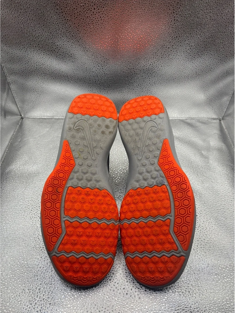 Nike legend trainer orange accents